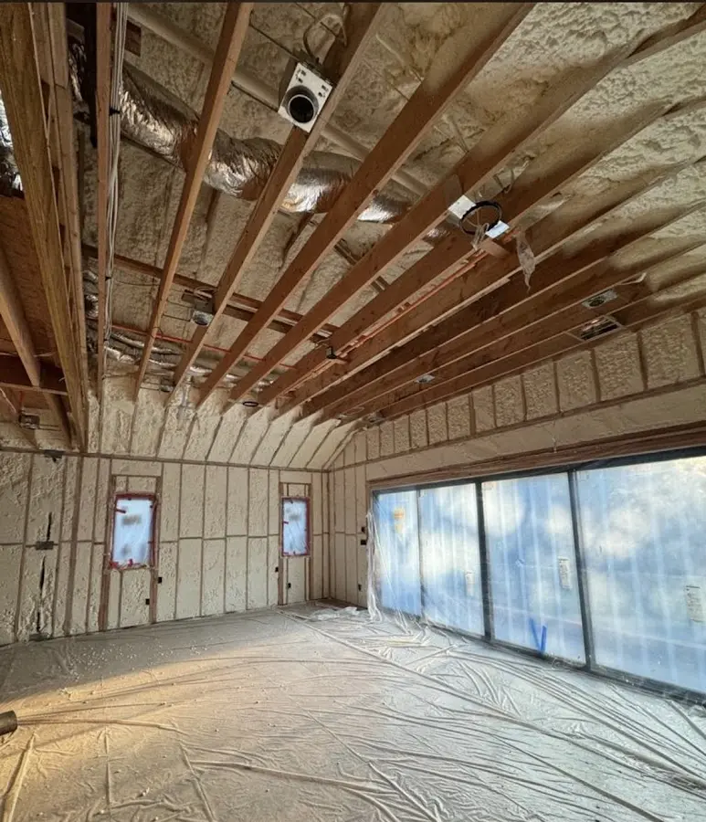 Interior walls and ceiling insulated with spray foam during new construction in West Bridgewater